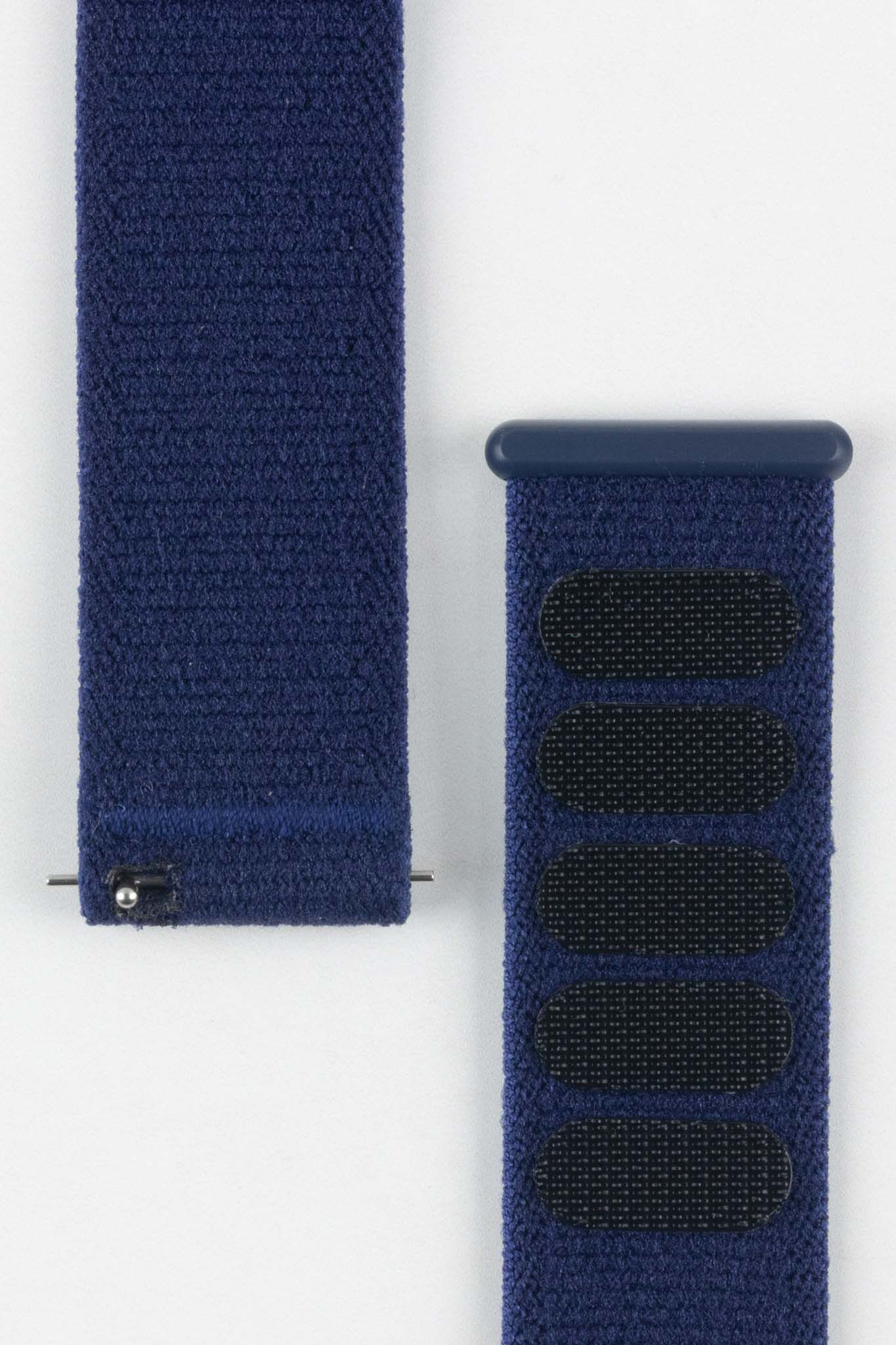Close-up detail of the vibrant HIRSCH Vocem Blue strap texture and the black hook-and-loop closure patches.