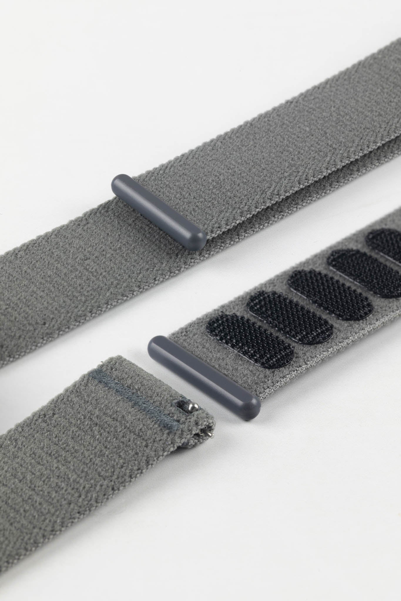Detail shot of HIRSCH Vocem Grey strap's quick-release pins and innovative hook-and-loop closure mechanism.