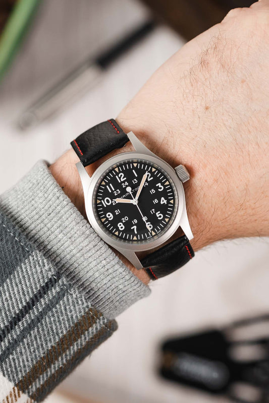 black leather watch strap with red stitching