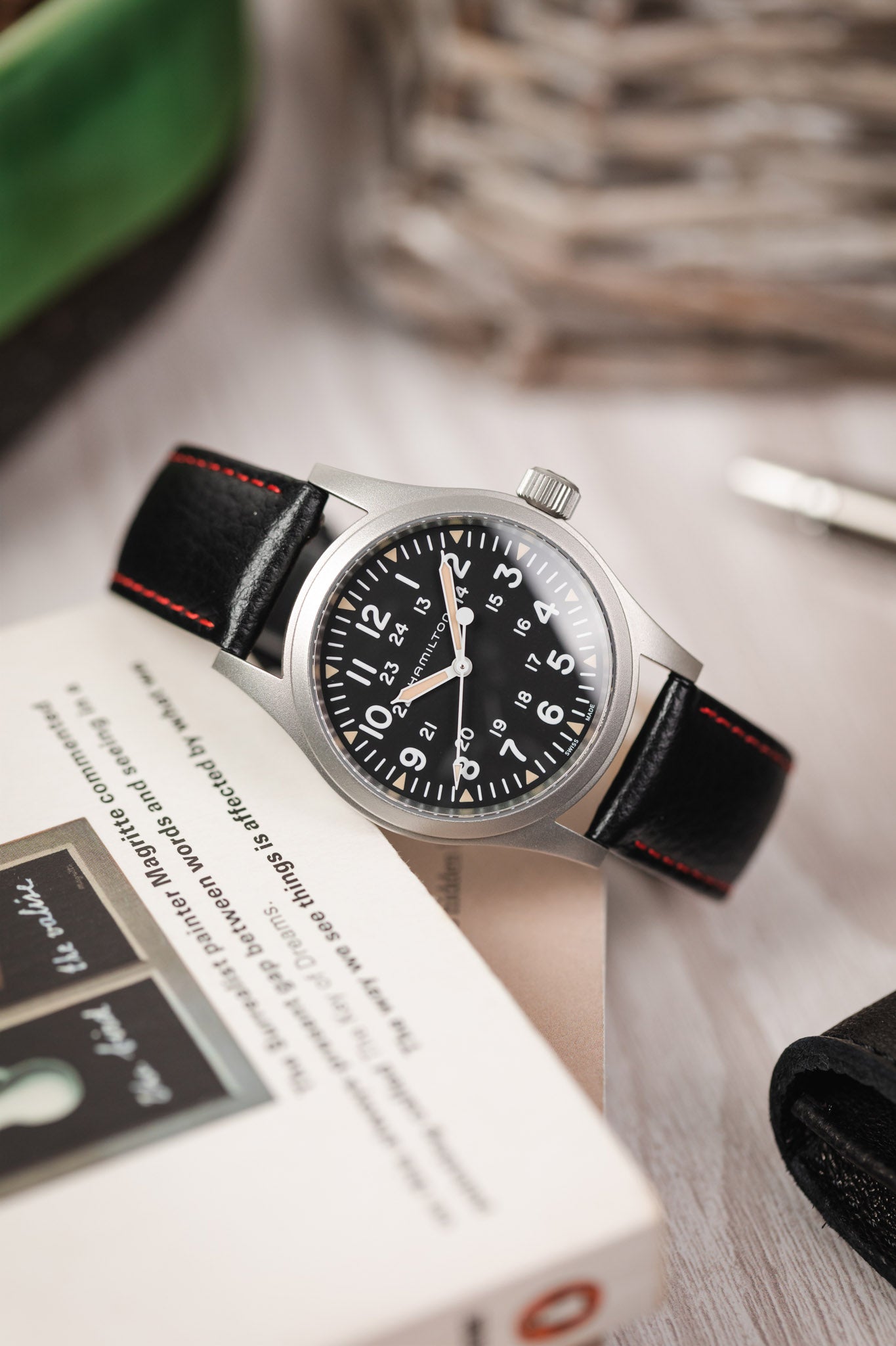 black leather watch strap red stitching