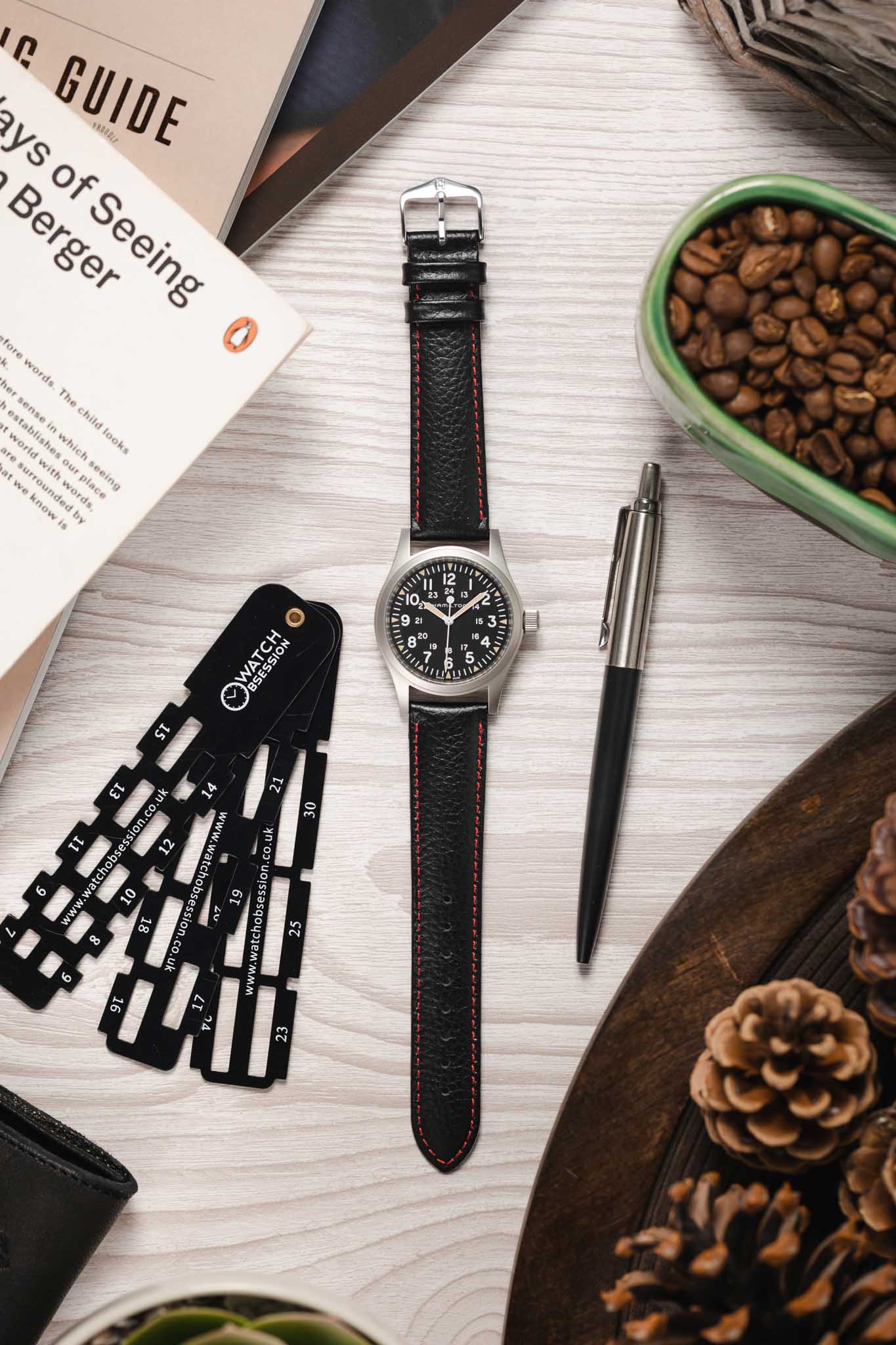 black leather watch strap red stitching