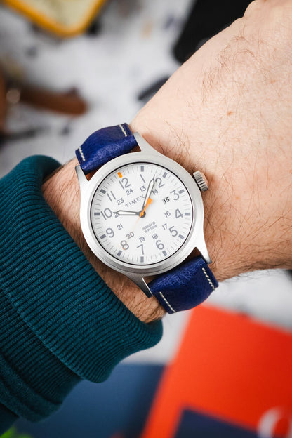 Wrist shot of a Timex Indiglo watch fitted with the vibrant Hirsch Boston Blue genuine leather watch strap.