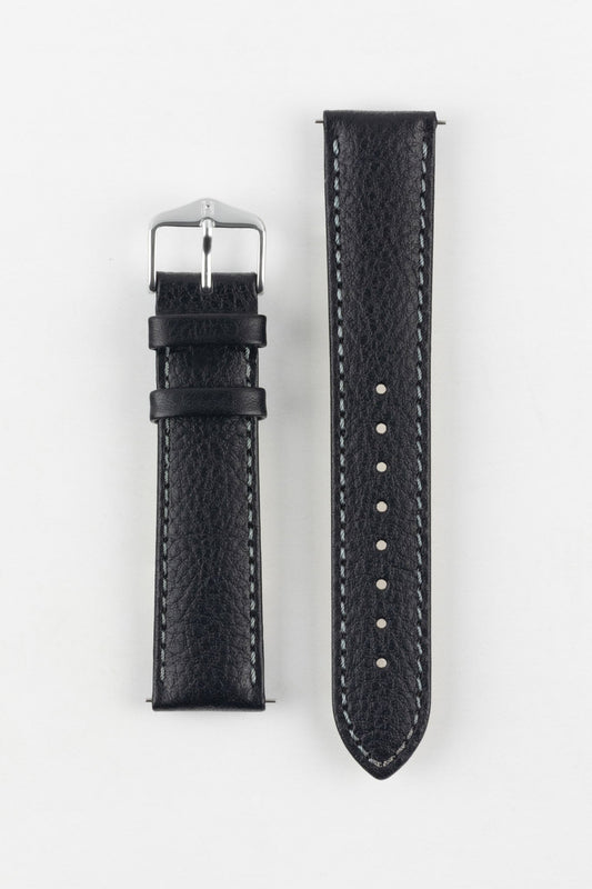 High-quality black watch strap with subtle grain texture and contrast white stitching, laid flat, with a classic silver buckle.