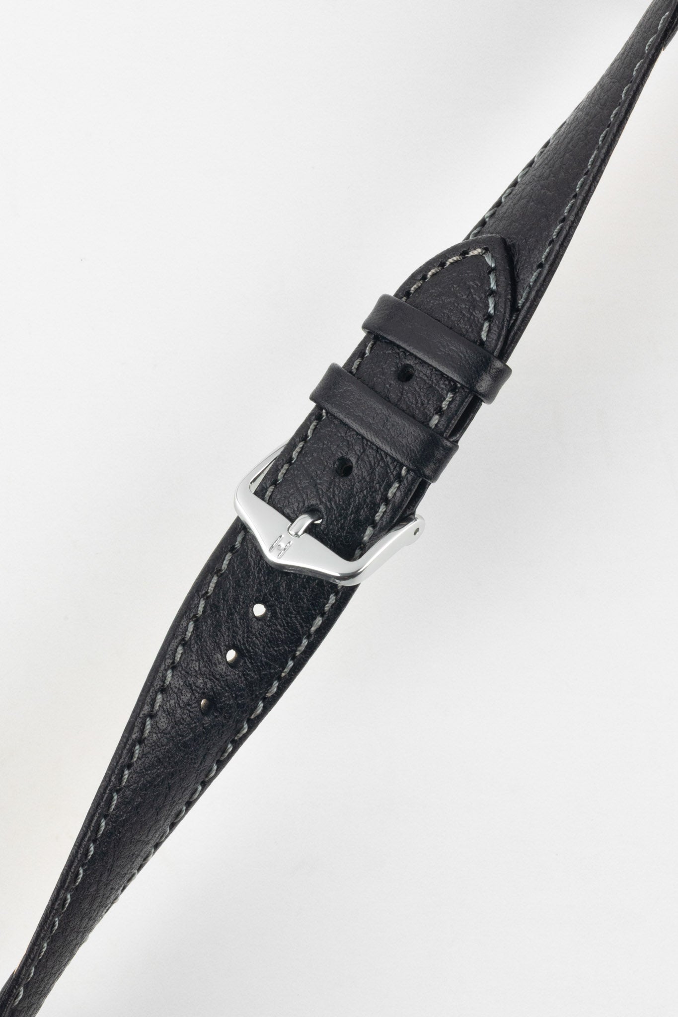 Elegant black leather watch strap with fine grain and white stitching, angled view, featuring a polished silver buckle.