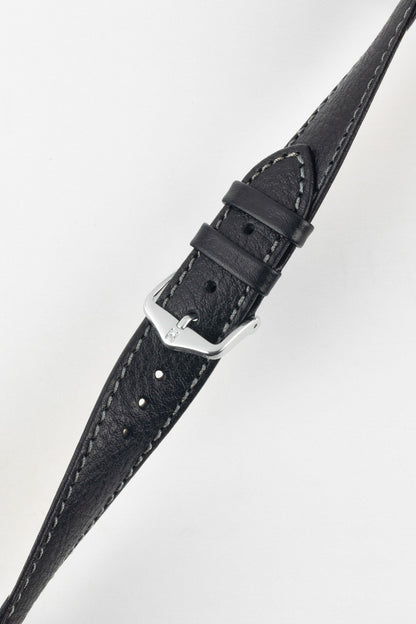 Elegant black leather watch strap with fine grain and white stitching, angled view, featuring a polished silver buckle.