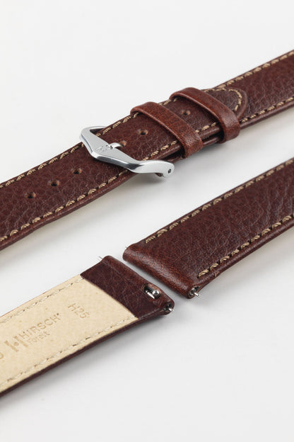 HIRSCH Forest brown quick-release watch strap with a polished silver buckle, showcasing the grained leather finish.
