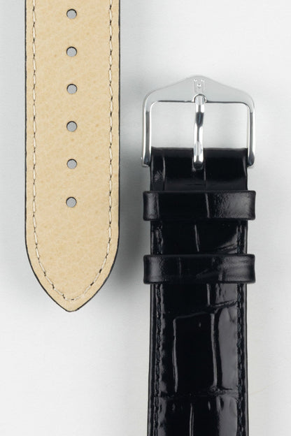 Close-up of the Louisianalook Black embossed strap showing the beige lining and a polished silver buckle.