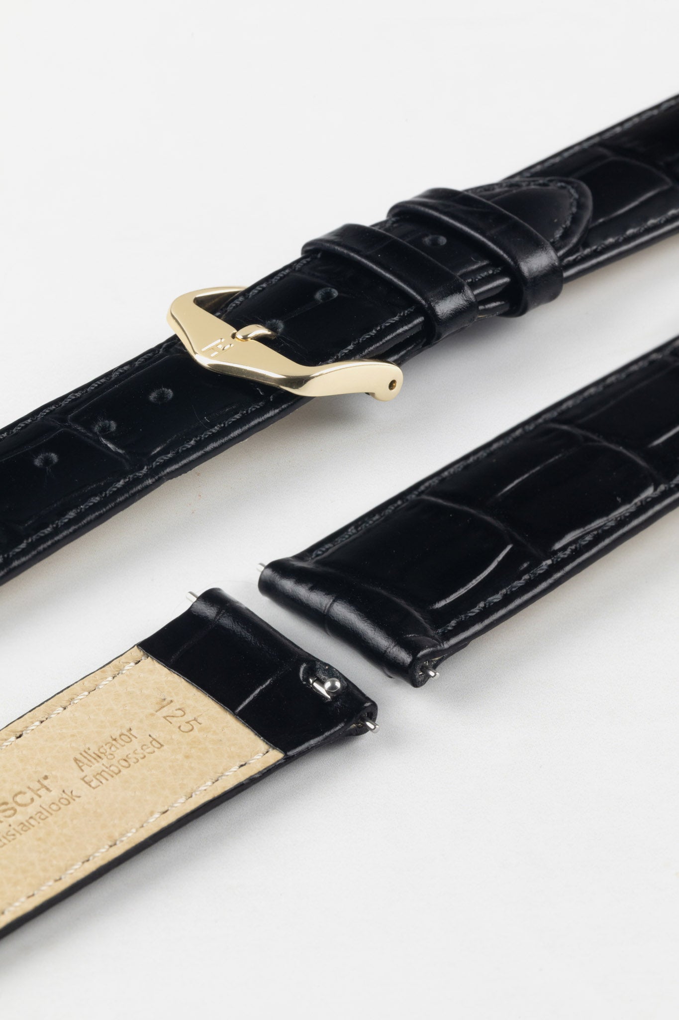 HIRSCH Louisianalook Black quick-release strap detail with alligator-look texture and a classic gold buckle.