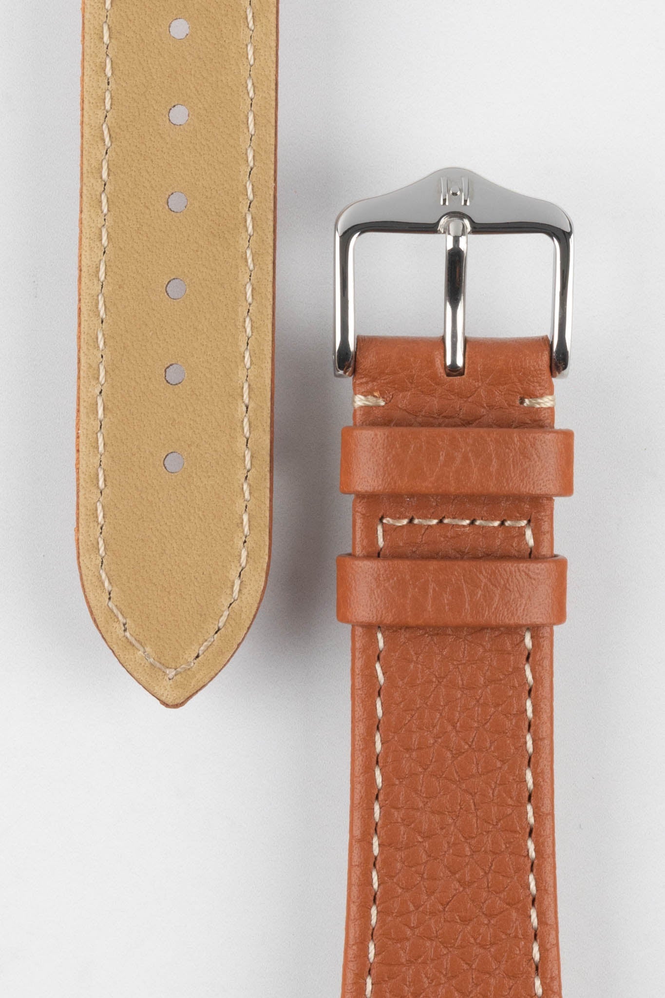 Buckle and Tail end of Gold Brown Hirsch Bologna Leather watch strap with logo embossed buckle