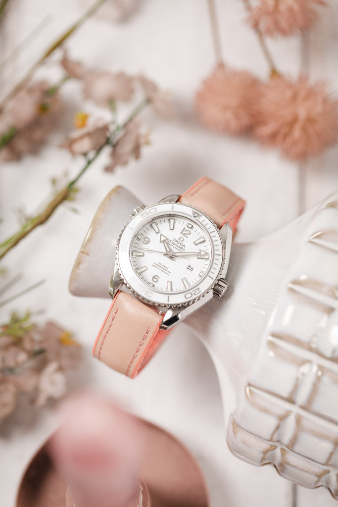 light pink watch strap on a watch