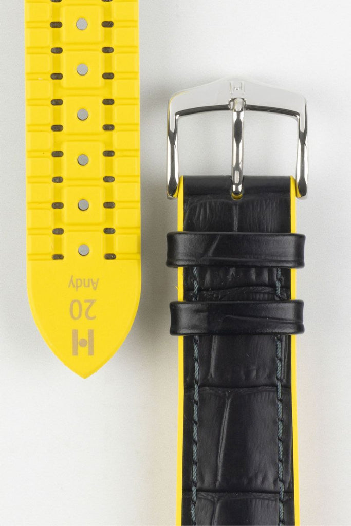 black and yellow watch strap (on wrist)