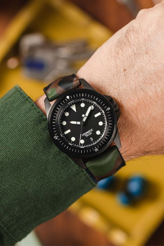 military green watch strap on watch
